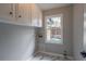 Bright laundry room with modern cabinets and large window at 5254 Greenpoint Dr, Stone Mountain, GA 30088