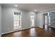 Bright living room with hardwood floors, large windows, and neutral gray paint at 5254 Greenpoint Dr, Stone Mountain, GA 30088