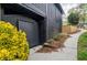 Side yard with stone path, wood fencing and dark painted brick exterior at 5254 Greenpoint Dr, Stone Mountain, GA 30088