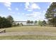 Expansive backyard with lush greenery, providing a serene and private outdoor space at 6025 Golf View Xing, Locust Grove, GA 30248