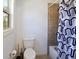 Cozy bathroom with a toilet, shower/bathtub combo, and minimalist decor at 6025 Golf View Xing, Locust Grove, GA 30248