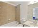 Bright bathroom featuring tile shower and floors, toilet, and large mirror at 6025 Golf View Xing, Locust Grove, GA 30248