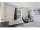 Bright bedroom featuring a window, desk and chair, and stylish decor at 6025 Golf View Xing, Locust Grove, GA 30248