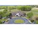Aerial view of community clubhouse with manicured grounds and parking at 6025 Golf View Xing, Locust Grove, GA 30248