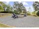 Inviting fire pit area with comfortable chairs, perfect for relaxing evenings outdoors at 6025 Golf View Xing, Locust Grove, GA 30248