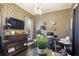 Stylish office space featuring a dark accent wall, modern desk, and unique decor at 6025 Golf View Xing, Locust Grove, GA 30248