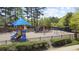 Community playground with slides, swings, and climbing equipment at 6025 Golf View Xing, Locust Grove, GA 30248