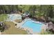 Aerial view of neighborhood pool with water slide, splash pad, and lounge chairs at 6025 Golf View Xing, Locust Grove, GA 30248