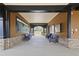 Covered community porch with stone accents and comfortable seating at 6025 Golf View Xing, Locust Grove, GA 30248