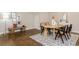 Dining area with hardwood floors, modern furniture, and white buffet with decor at 1329 Booth Ave, Atlanta, GA 30318