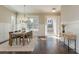 Charming dining room with a wooden table, elegant lighting, and bright windows at 1329 Booth Ave, Atlanta, GA 30318