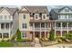 Charming two-story home featuring a brick and siding exterior, covered porch, and well-manicured landscaping at 1329 Booth Ave, Atlanta, GA 30318