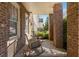 Inviting covered front porch with rocking chairs, brick pillars, and a view of the landscaped yard at 1329 Booth Ave, Atlanta, GA 30318