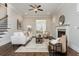 Well-lit living room with hardwood floors, fireplace, and comfortable seating arrangement at 1329 Booth Ave, Atlanta, GA 30318