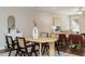Open concept featuring dining table, staircase, and living room with a ceiling fan at 1329 Booth Ave, Atlanta, GA 30318