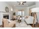 Inviting living room with fireplace, ceiling fan, stylish furnishings, and neutral color palette at 1329 Booth Ave, Atlanta, GA 30318