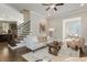 Comfortable living room with stylish furniture, hardwood floors, and an open view of the kitchen at 1329 Booth Ave, Atlanta, GA 30318
