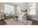 Bright living room with large windows, neutral furnishings, and a stylish rug at 1329 Booth Ave, Atlanta, GA 30318