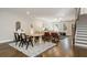 Open concept featuring dining table, staircase, and living room with a ceiling fan at 1329 Booth Ave, Atlanta, GA 30318