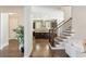 A well-lit living space connects the living room, staircase, and modern kitchen, promoting seamless transitions at 1329 Booth Ave, Atlanta, GA 30318