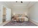 Comfortable main bedroom with soft lighting, neutral decor, and a decorative rug at 1329 Booth Ave, Atlanta, GA 30318