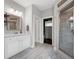 Bathroom with white cabinets, granite countertops, glass shower, and tile flooring at 1344 Chipmunk Forest Chase, Powder Springs, GA 30127