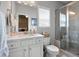 Bathroom featuring white vanity, countertop, and glass enclosed shower at 1344 Chipmunk Forest Chase, Powder Springs, GA 30127