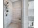 Bathroom featuring white tile, a shower, a bathtub, and a window with blinds at 1344 Chipmunk Forest Chase, Powder Springs, GA 30127