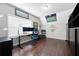 Spacious bedroom with hardwood floors, large window, and a Packers theme at 1344 Chipmunk Forest Chase, Powder Springs, GA 30127