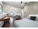 Spacious bedroom/flex room featuring hardwood floors, exposed brick and comfortable seating at 1344 Chipmunk Forest Chase, Powder Springs, GA 30127