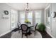 Charming dining area with natural light, a round table, and elegant decor at 1344 Chipmunk Forest Chase, Powder Springs, GA 30127