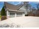 Three car garage with basketball hoop and spacious driveway at 1344 Chipmunk Forest Chase, Powder Springs, GA 30127