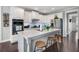 Bright kitchen with stainless steel appliances, a large island, and hardwood floors at 1344 Chipmunk Forest Chase, Powder Springs, GA 30127