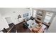 Spacious living room boasts vaulted ceilings, exposed brick fireplace, hardwood floors, and lots of natural light at 1344 Chipmunk Forest Chase, Powder Springs, GA 30127