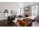 Bright living room features a brick fireplace, hardwood floors, and stylish furnishings at 1344 Chipmunk Forest Chase, Powder Springs, GA 30127