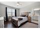 Comfortable main bedroom with a view of the ensuite bathroom at 1344 Chipmunk Forest Chase, Powder Springs, GA 30127