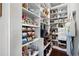 Walk-in pantry with well-organized shelving, storing food and kitchen essentials at 1344 Chipmunk Forest Chase, Powder Springs, GA 30127
