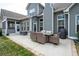 Outdoor patio with dining set and grill, perfect for entertaining at 1344 Chipmunk Forest Chase, Powder Springs, GA 30127
