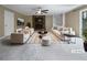 Bright, staged living room featuring a stone fireplace and built-in shelving at 1899 Stratford Arms Dr, Morrow, GA 30260