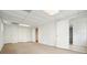 Finished basement space with ample storage, featuring multiple closets, lighting, and carpeting at 281 Piedmont Ne Rd, Marietta, GA 30066