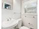 This is a traditional bathroom with a pedestal sink, toilet, and towel rack at 281 Piedmont Ne Rd, Marietta, GA 30066