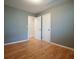 Comfortable bedroom featuring wood floors and two doors at 281 Piedmont Ne Rd, Marietta, GA 30066