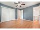 An airy bedroom offers hardwood floors with a ceiling fan, closet, and en suite bathroom at 281 Piedmont Ne Rd, Marietta, GA 30066