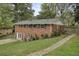 Brick two-story home features a large driveway, fenced yard, and professional landscaping at 281 Piedmont Ne Rd, Marietta, GA 30066