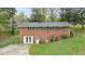 Brick two-story home features a large lot, a fenced yard, and mature trees at 281 Piedmont Ne Rd, Marietta, GA 30066