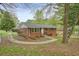 A cozy brick home with a well-maintained yard, showcasing its inviting curb appeal in a lush setting at 281 Piedmont Ne Rd, Marietta, GA 30066
