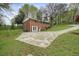 Brick two-story home features a large driveway, and a well-maintained lawn and landscaping at 281 Piedmont Ne Rd, Marietta, GA 30066