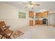 Open kitchen and dining area with wood cabinets, stainless steel appliances, and ceiling fan at 281 Piedmont Ne Rd, Marietta, GA 30066