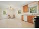 A bright kitchen with oak cabinets, a stainless steel range, and a casual eating area near the back door at 281 Piedmont Ne Rd, Marietta, GA 30066