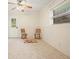 Bright room featuring two chairs, wainscotting, neutral paint, and a ceiling fan at 281 Piedmont Ne Rd, Marietta, GA 30066
